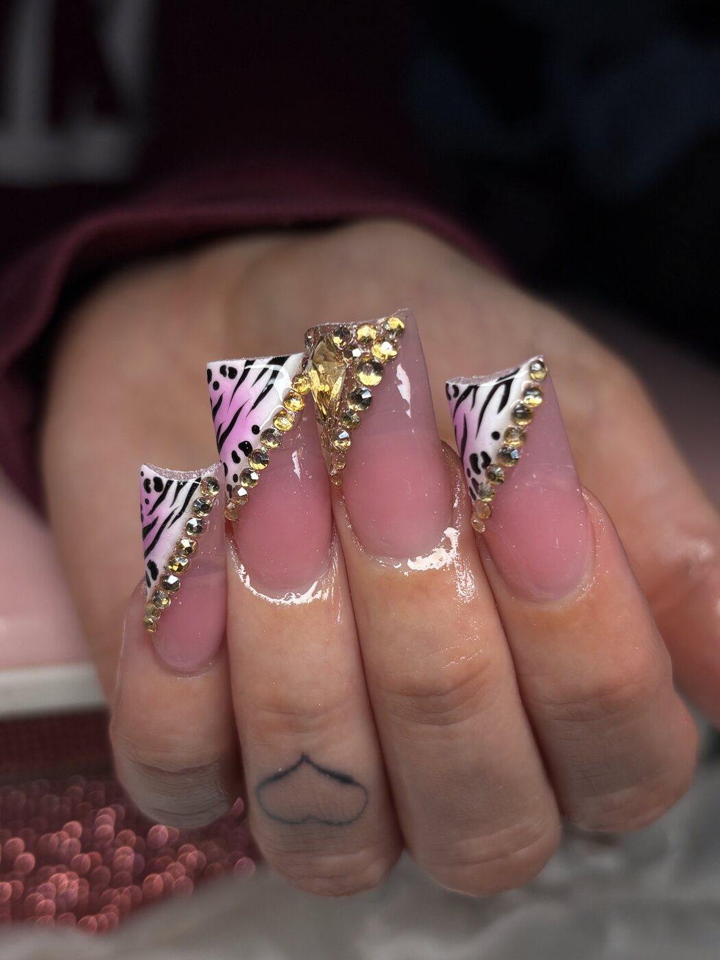 Long pink and black zebra tips with gold gems and rhinestone borders